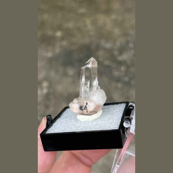Small clear quartz point on matrix from Guangdong — alternate view