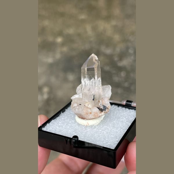 Small clear quartz point on matrix from Guangdong — detail view