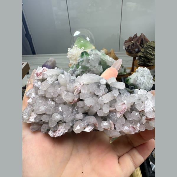 Quartz cluster with green chlorite and red calcite rosettes — alternate view