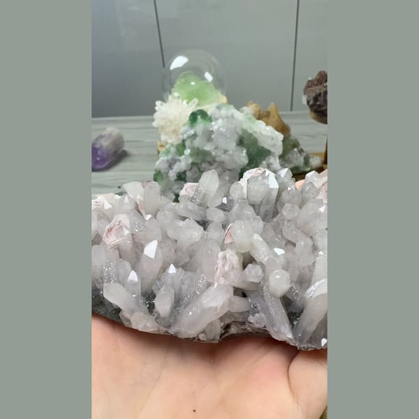 Quartz cluster with green chlorite and red calcite rosettes — alternate view