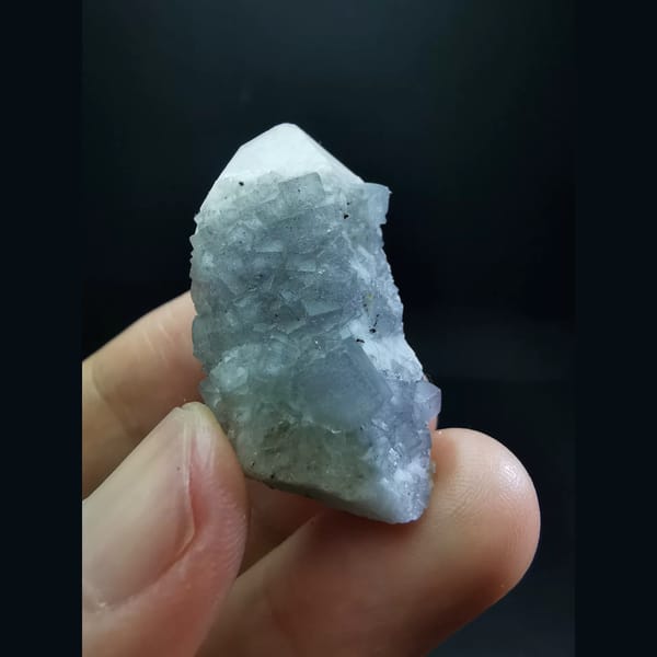 Pale blue-purple fluorite on white candle quartz — complete view