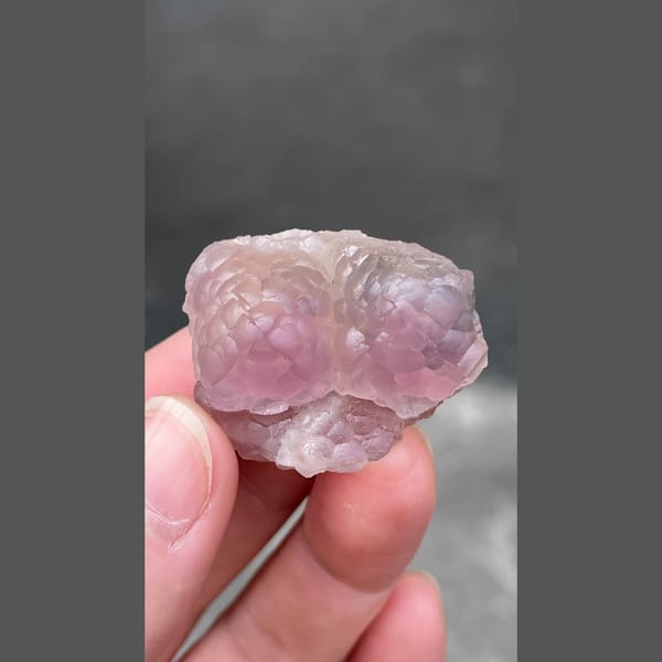 Pink purple sculpted fluorite from Zhejiang — detail view