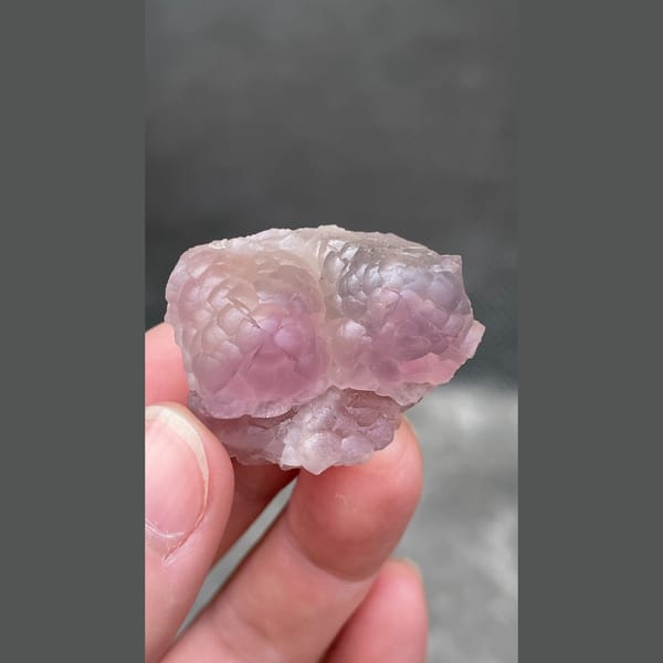 Pink purple sculpted fluorite from Zhejiang — detail view