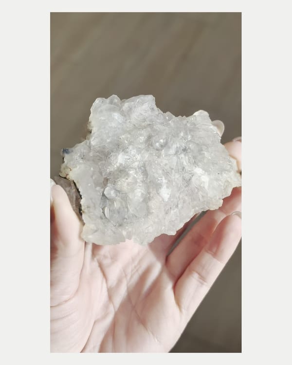 Complete front view of white phantom quartz cluster