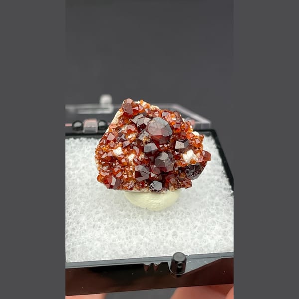 Sparkling red orange garnet cluster from Fujian — detail view