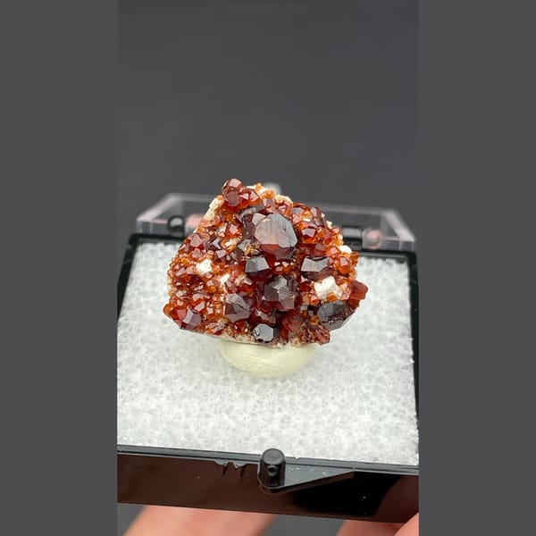 Sparkling red orange garnet cluster from Fujian — detail view