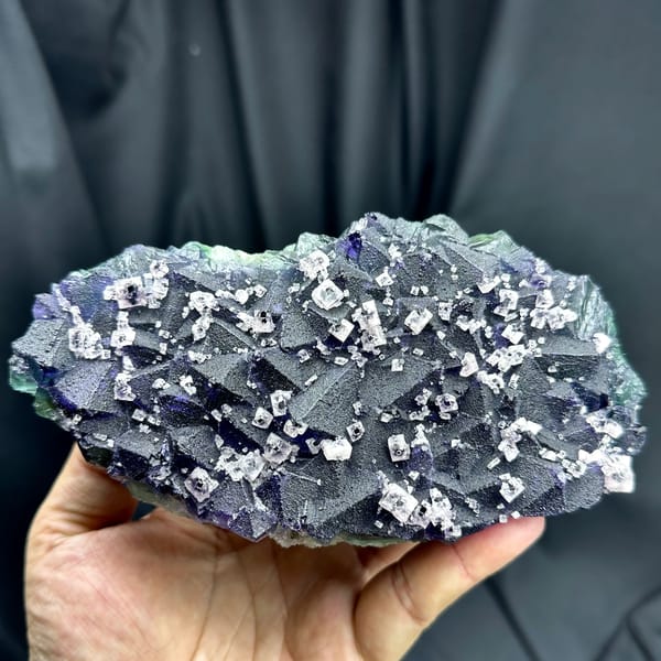Blue-green-purple octahedral fluorite with white secondary cubes from Zhejiang — complete view