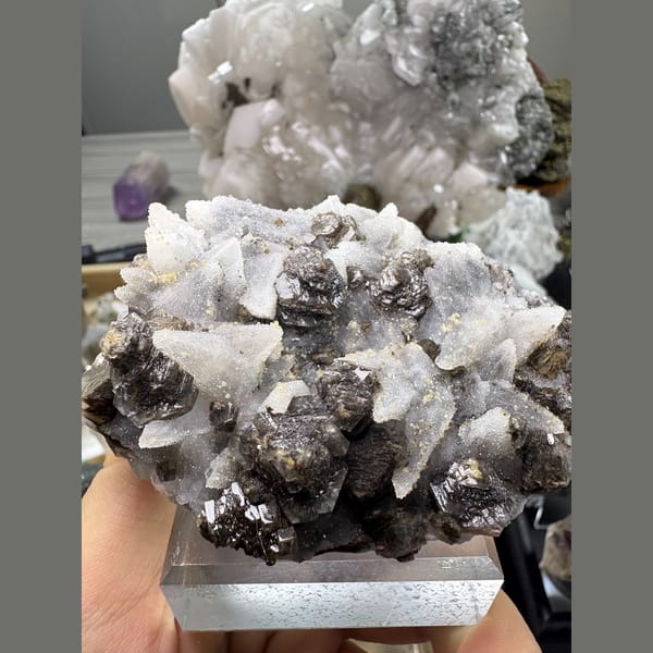 Dogtooth calcite with sugary quartz and a dark mineral — alternate view