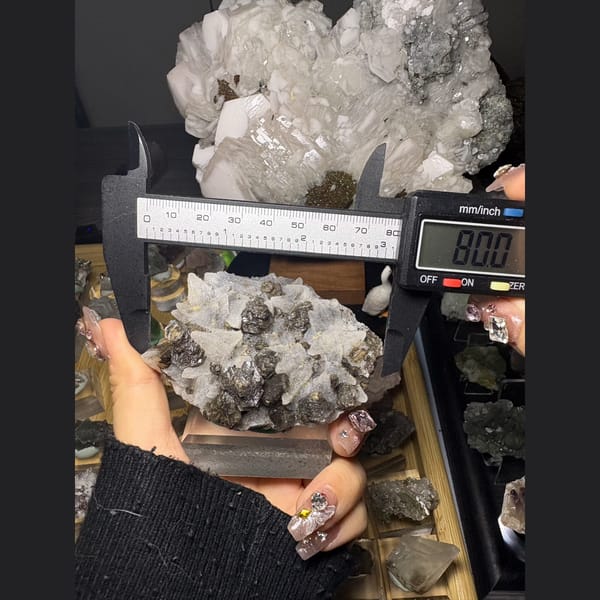 Dogtooth calcite with sugary quartz and a dark mineral — alternate view
