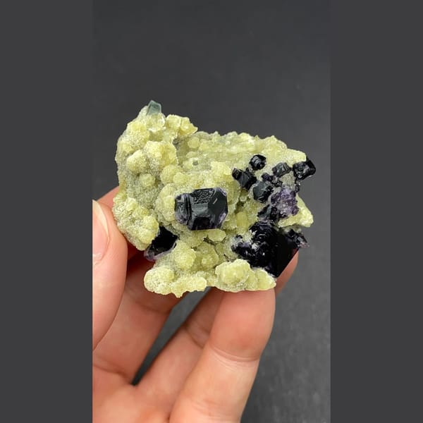 Dark fluorite cluster on mica from Inner Mongolia — alternate view