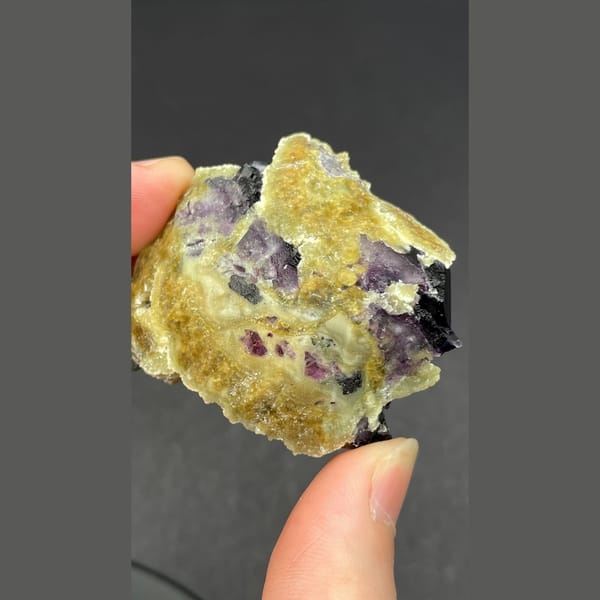 Dark fluorite cluster on mica from Inner Mongolia — detail view