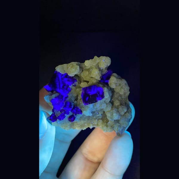 Dark fluorite cluster on mica from Inner Mongolia — detail view