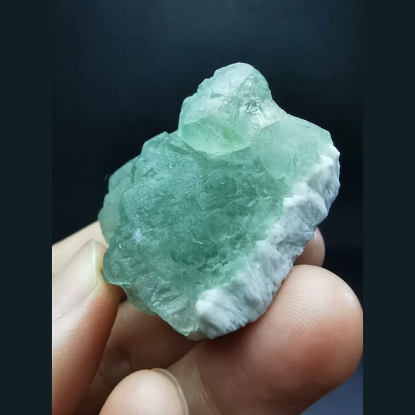 Green fluorite cluster on quartz matrix — complete view