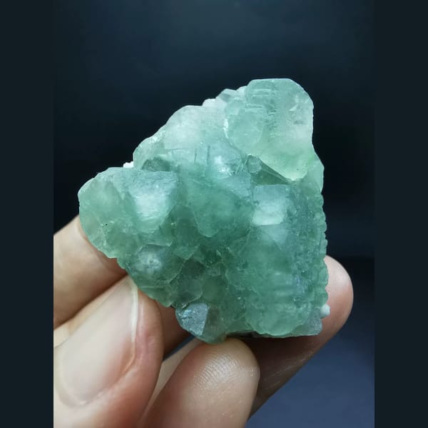 Green fluorite cluster on quartz matrix — alternate view