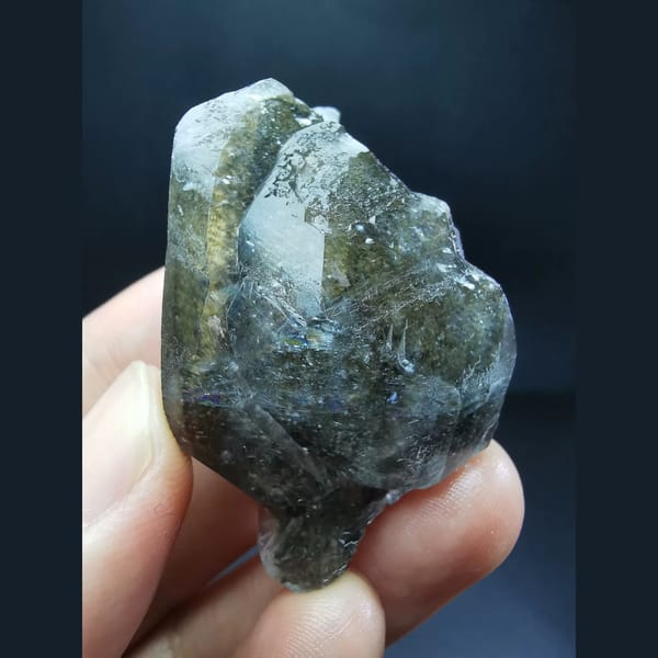 Chocolate-brown ice-skin calcite crystal — complete view