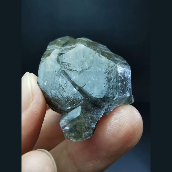 Chocolate-brown ice-skin calcite crystal — alternate view