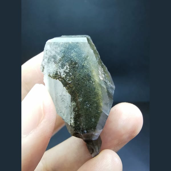 Chocolate-brown ice-skin calcite crystal — alternate view