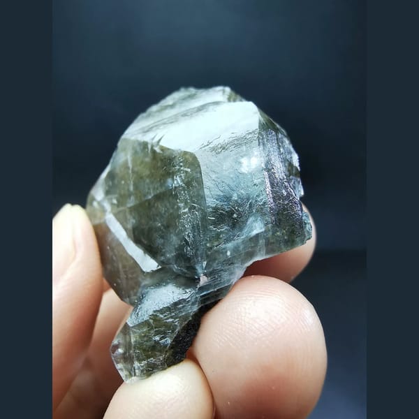 Chocolate-brown ice-skin calcite crystal — detail view