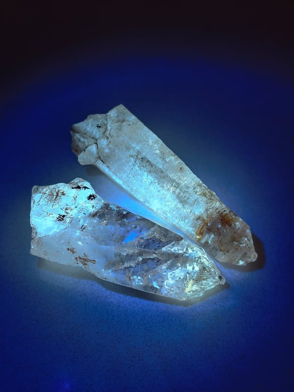 Petroleum Inclusion Quartz Pair with Red Clay — Madagascar — individual mineral specimen view 1