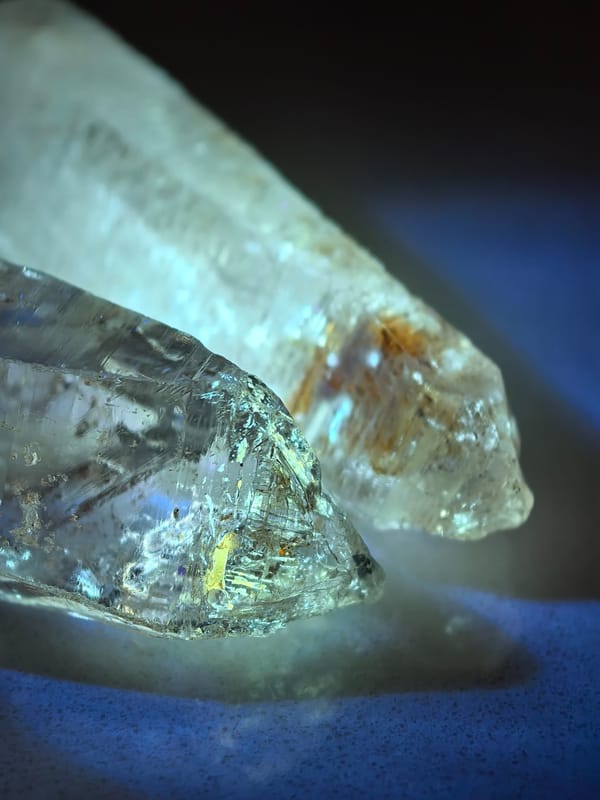 Petroleum Inclusion Quartz Pair with Red Clay — Madagascar — individual mineral specimen view 2