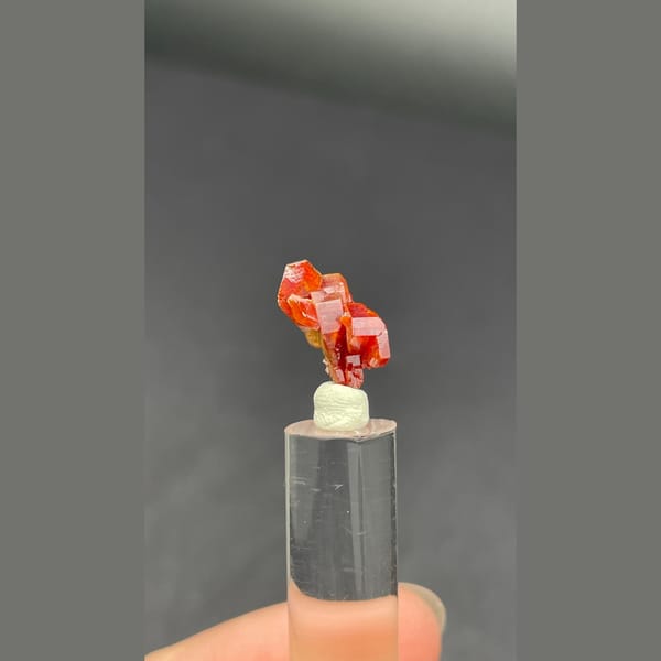 Tiny stacked red vanadinite crystals from Morocco — detail view