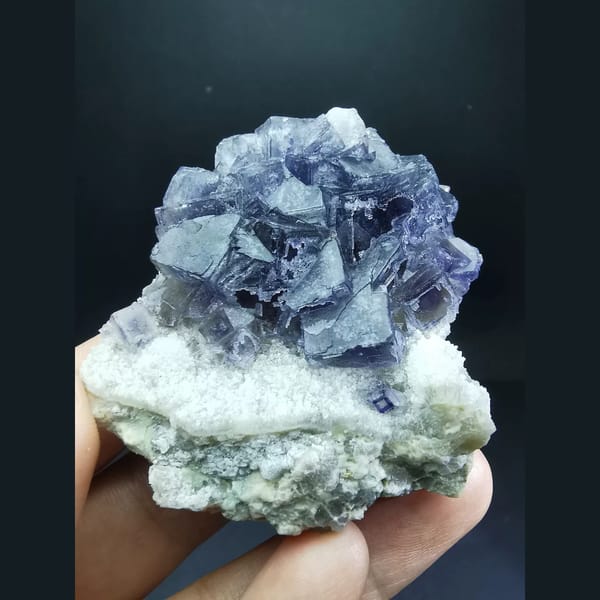 Etched purple fluorite cluster from Jinshan, Chifeng — complete view