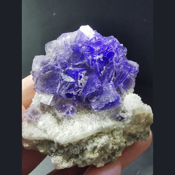 Etched purple fluorite cluster from Jinshan, Chifeng — detail view