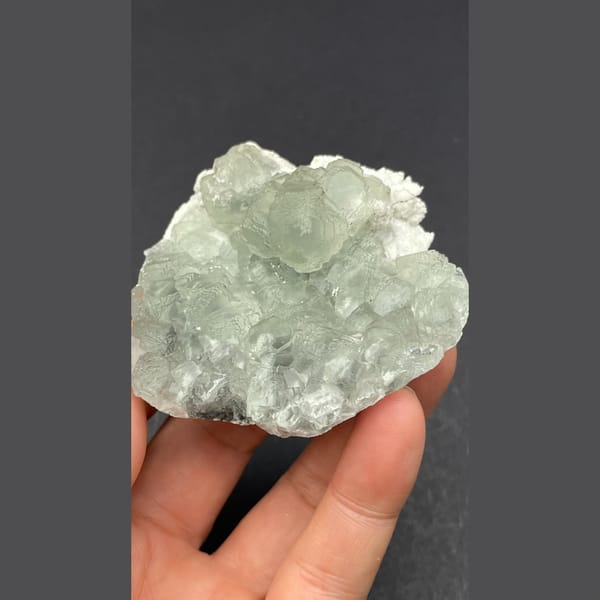 Pale green fluorite on white quartz from Guangdong — detail view