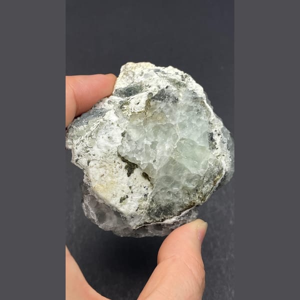Pale green fluorite on white quartz from Guangdong — detail view