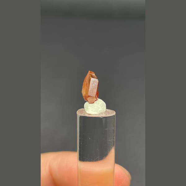 Single flat red vanadinite crystal from Morocco — alternate view