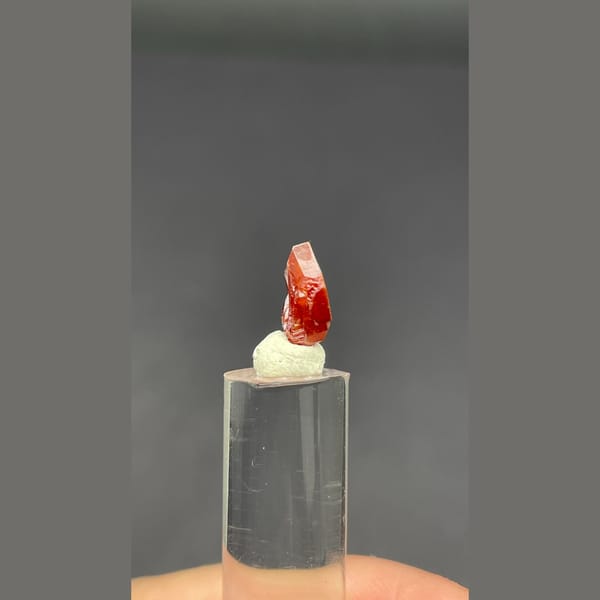 Single flat red vanadinite crystal from Morocco — alternate view