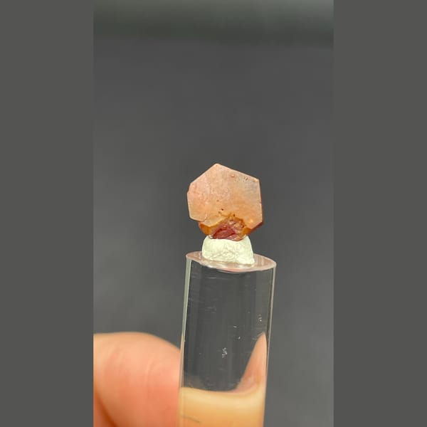 Single flat red vanadinite crystal from Morocco — detail view