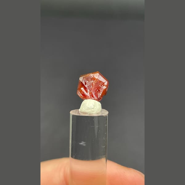 Single flat red vanadinite crystal from Morocco — detail view