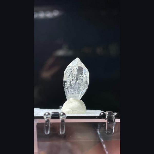 Clear quartz point with inclusion from Pakistan — alternate view
