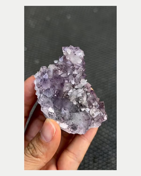 Complete front view of Brazilian amethyst quartz with calcite