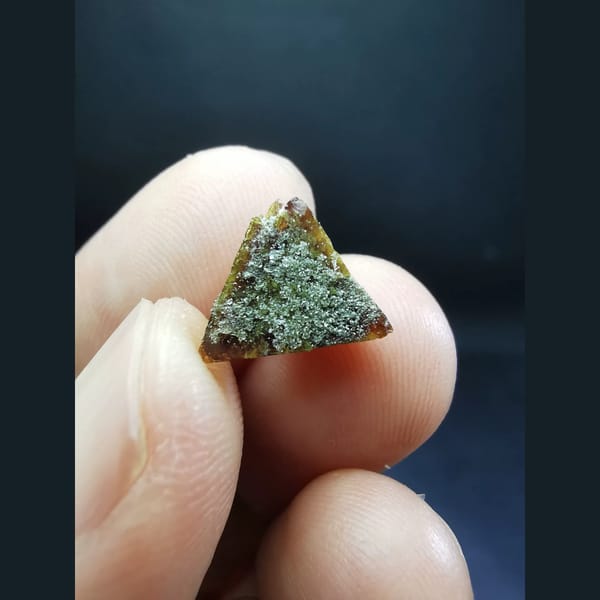 Gem-quality floater helvine crystal with sugary quartz — alternate view
