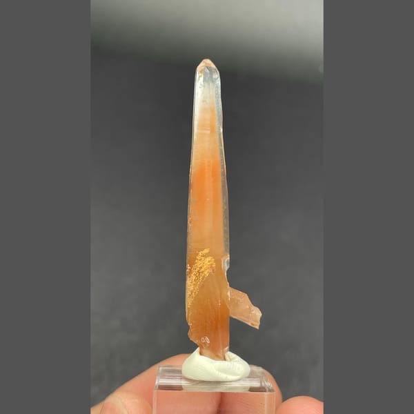 Slender quartz with red rutile needles from Madagascar — alternate view