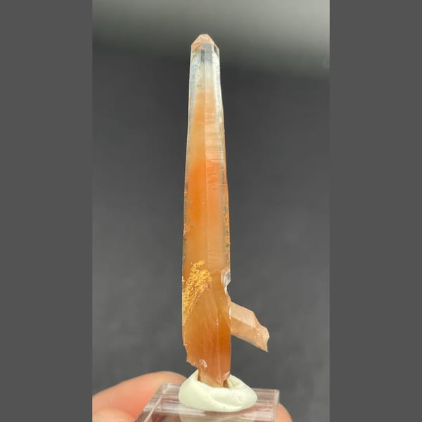 Slender quartz with red rutile needles from Madagascar — detail view