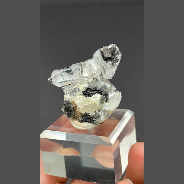 Clear quartz on specular hematite from Guangdong — alternate view