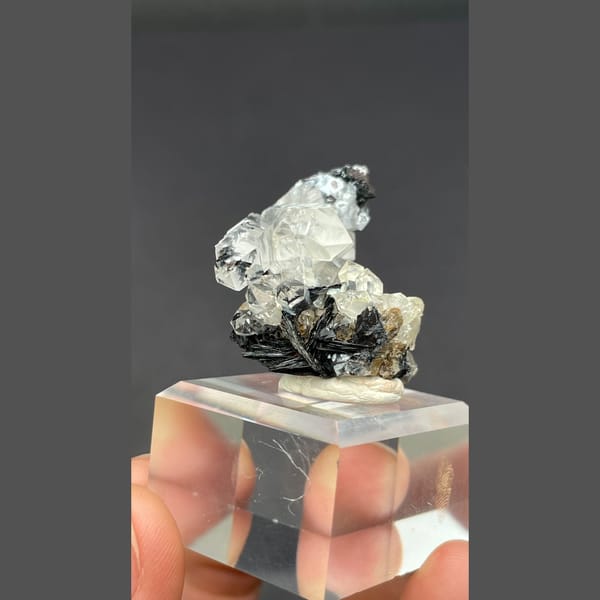 Clear quartz on specular hematite from Guangdong — detail view