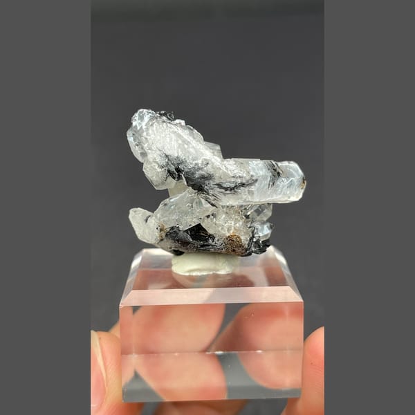 Clear quartz on specular hematite from Guangdong — detail view