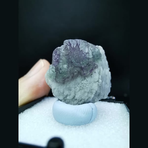 Blue fluorite with purple flower-like etch patterns — alternate view