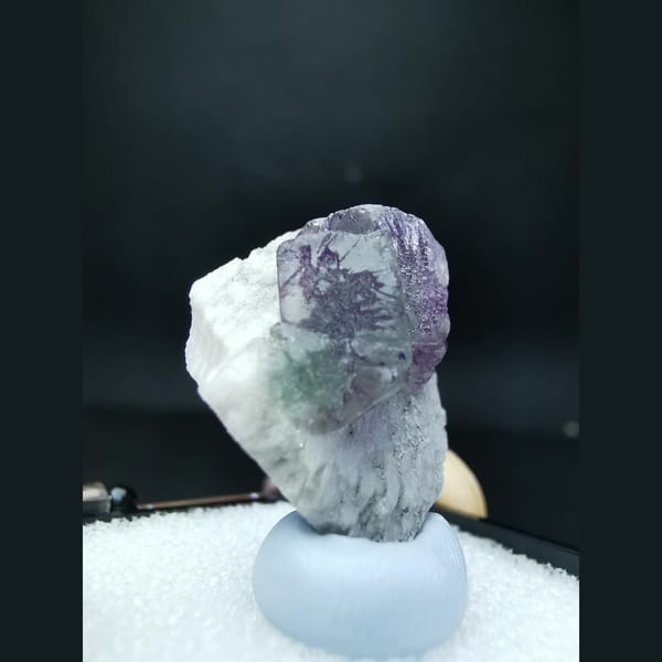 Blue fluorite with purple flower-like etch patterns — alternate view