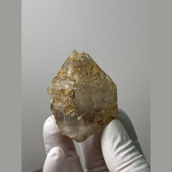 Etched yellowish double-terminated quartz floater from Yunnan — complete view