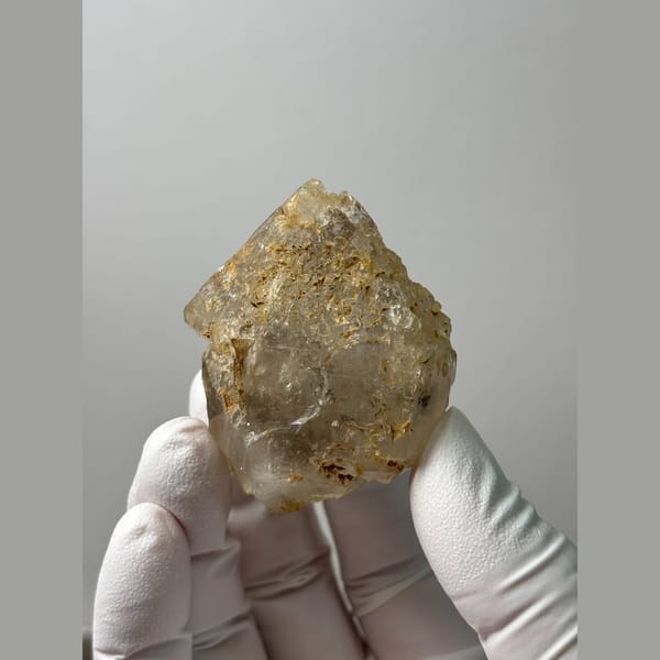 Etched yellowish double-terminated quartz floater from Yunnan — alternate view