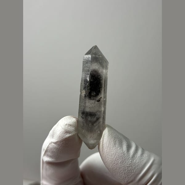 Slender clear double-terminated quartz from Sichuan — complete view