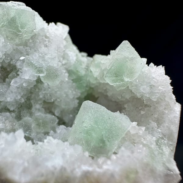 Pale green octahedral fluorite on white quartz from Inner Mongolia — alternate view