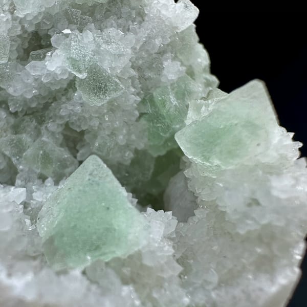 Pale green octahedral fluorite on white quartz from Inner Mongolia — alternate view