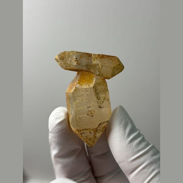 Multi-terminated quartz with weathered iron-stained cap from Yunnan — alternate view
