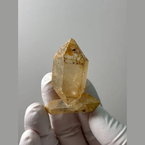 Multi-terminated quartz with weathered iron-stained cap from Yunnan — detail view